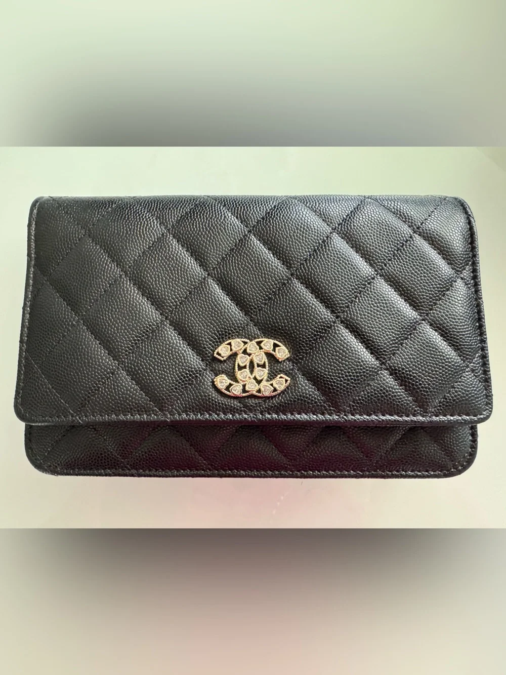 CHANEL WOC Black caviar leather with Gold Hardware and heart shaped crystal logo